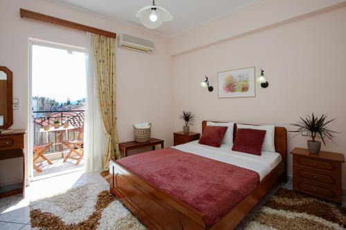 Postel nebo postele na pokoji v ubytování Hotel Triantafyllou