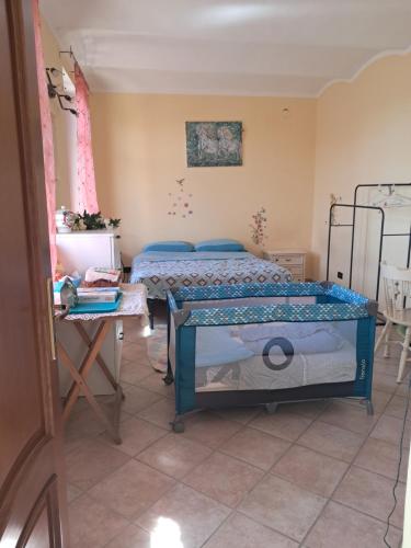 Postel nebo postele na pokoji v ubytování Cascina Argo