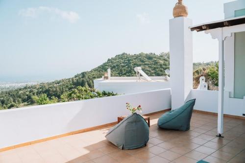 a balcony with a view of a mountain at Infinity II - Modern Family Retreat in Kos in Lagoúdi Zía