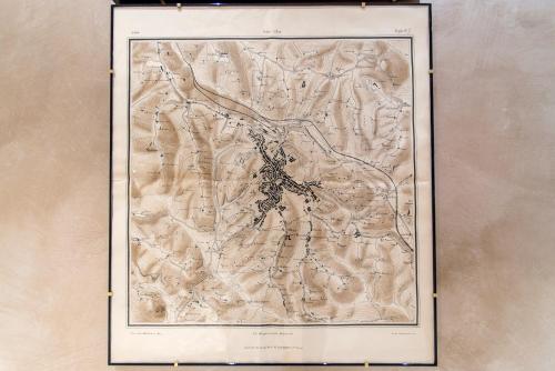 a drawing of a map on a wall at La Martinella by Palazzo Bianchini in Siena