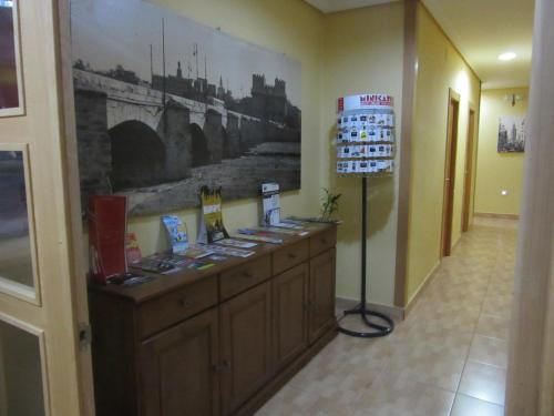 a room with a counter with a picture on the wall at Hostal Abastos in Valencia