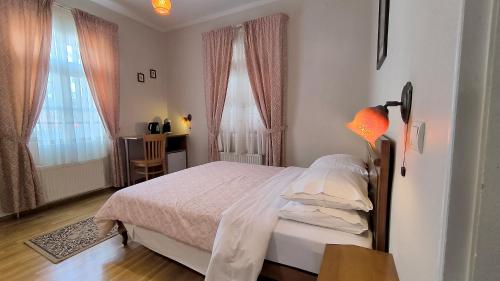 Ένα ή περισσότερα κρεβάτια σε δωμάτιο στο Venetula's Rooms - Kirkiri