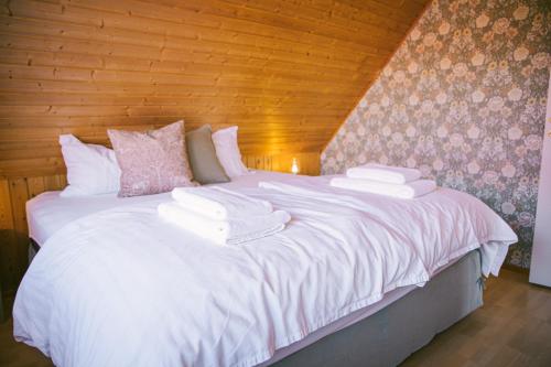 Postel nebo postele na pokoji v ubytování Milli Vina Guesthouse
