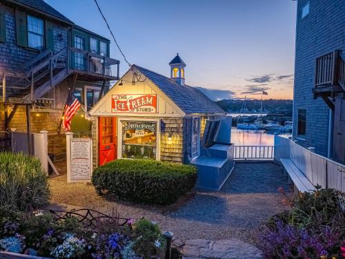 a restaurant with a sign in front of a building at Addison Choate in Rockport