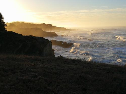 a view of the ocean at sunset at Stunning views near beaches and bluff in Sea Ranch