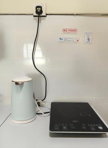 a laptop computer sitting on top of a counter at Ayer Keroh B202 6pax Cozy Stay - GXHomes in Ayer Keroh