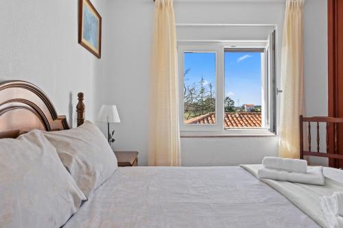 Postel nebo postele na pokoji v ubytování El rincón de Pocholo