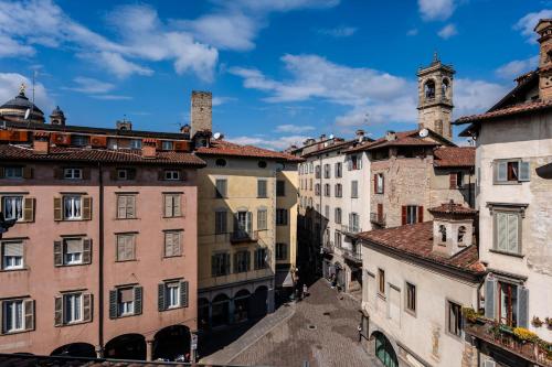 a view of a city street with buildings at Palazzo Porta Picta in Bergamo