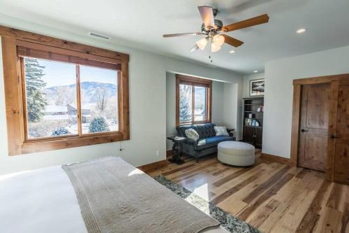 a bedroom with a bed and a ceiling fan at Mountain Lodge Oasis w Hot Tub-Rio Grande Trail in Carbondale
