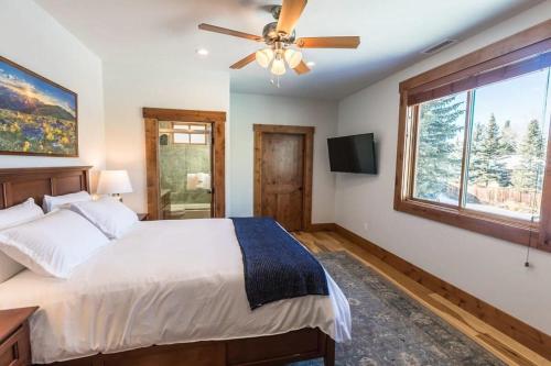 a bedroom with a bed and a ceiling fan at Mountain Lodge Oasis w Hot Tub-Rio Grande Trail in Carbondale