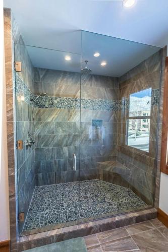 a bathroom with a shower with a glass door at Mountain Lodge Oasis w Hot Tub-Rio Grande Trail in Carbondale