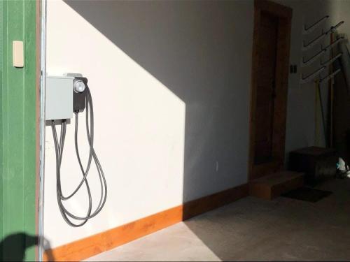 a room with a hose hanging from a wall at Mountain Lodge Oasis w Hot Tub-Rio Grande Trail in Carbondale