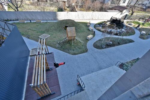 a person is playing in a playground with a water slide at Komitas Comfort and Charm in Yerevan