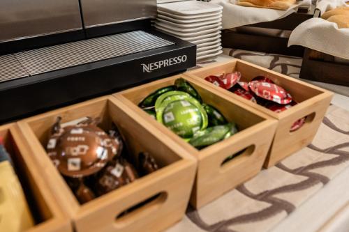 two boxes of peppers sitting on a kitchen floor at Palazzo Porta Picta in Bergamo