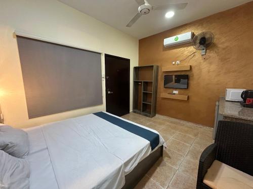 Giường trong phòng chung tại Relax House For Studio Rooms Apartment