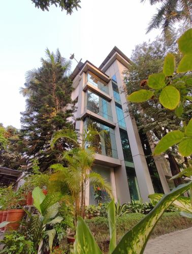 a building with plants in front of it at Sher-E-Punjab in Kolkata