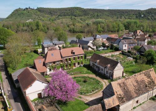 an aerial view of a village with a house at Les Jardins de Félicie in Poses