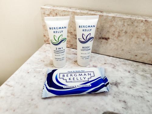 two bottles of eternal light products on a bathroom counter at Spacious 2-BR 1-Bath King suite! in Plainville