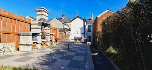 a street in a residential neighborhood with a fence at Home away from home in Belfast