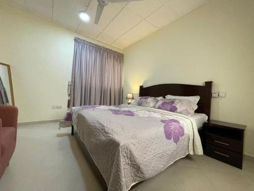 Llit o llits en una habitació de KD Apartment