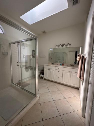 a bathroom with a shower and a glass shower stall at Villa Vera with Lake view in Naples