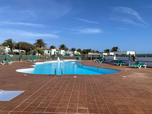 a large swimming pool with a fountain in the middle at Casa Gioeli Cocosol in Costa de Antigua