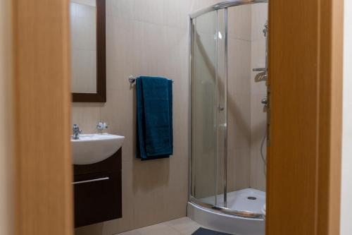 a bathroom with a shower and a sink at IssA Lighthouse in Balchik