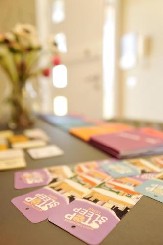 a table with cards on top of a table at Stop & Sleep Udine in Udine