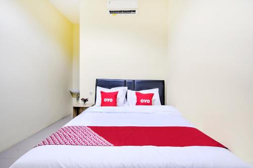 Ένα ή περισσότερα κρεβάτια σε δωμάτιο στο Hotel O Tebel 19