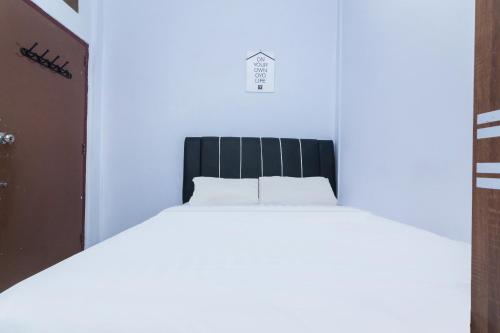 Postel nebo postele na pokoji v ubytování OYO Life 2670 Aline Kost