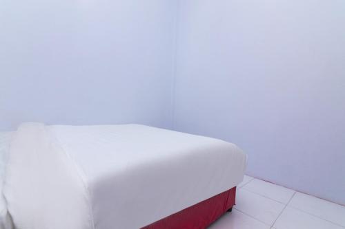 Postel nebo postele na pokoji v ubytování OYO Life 2670 Aline Kost
