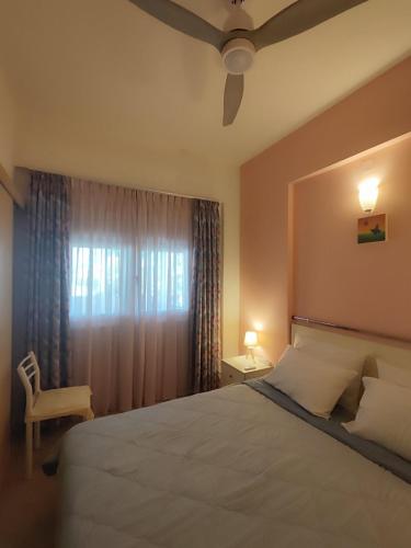 Ένα ή περισσότερα κρεβάτια σε δωμάτιο στο Beautiful apartment near the beach