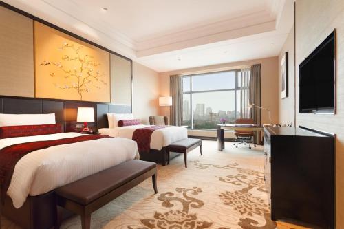 Postel nebo postele na pokoji v ubytování Wyndham Grand Xi'an South
