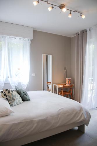 Postel nebo postele na pokoji v ubytování Casa Rosetta - Relax in Centro, Parcheggio Privato, Mare a 2 Passi