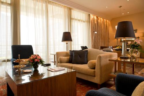 a living room with a couch and a table at Phoenicia Residence in Beirut