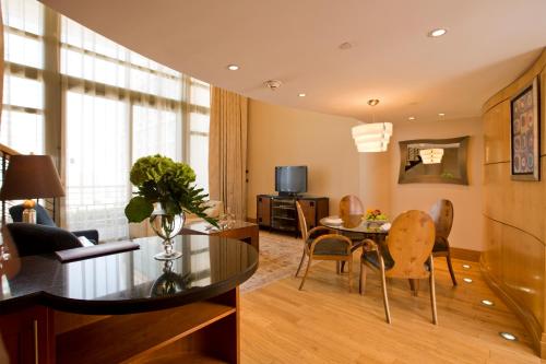 a living room with a table and a dining room at Phoenicia Residence in Beirut