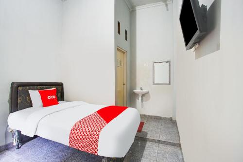 Кровать или кровати в номере Hotel O Teluk Betung Near Taman Dipangga Formerly Z Hotel