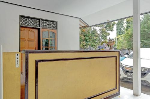 a garage door in front of a house at OYO 3096 Hotel Dewi Warsiki Near Gilimanuk Port in Gilimanuk