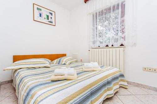 Кровать или кровати в номере Apartments Lavanda 1