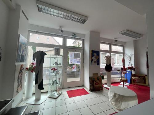 a room with a glass door with clothes on display at Atelier Suite in Reutlingen