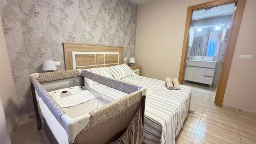 Postel nebo postele na pokoji v ubytování Olas de Oro, relájate, descansa y disfruta