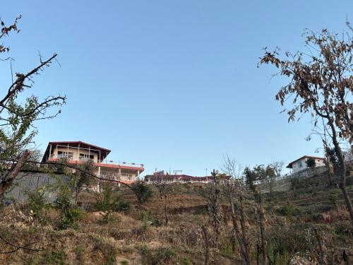 a house on top of a hill at The Whitegrove Retreat in Mukteswar