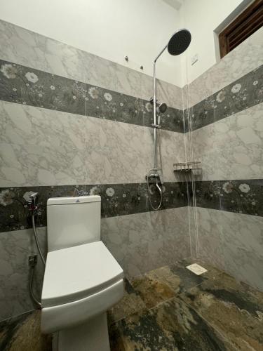 Koupelna v ubytování Hotel UK Pasikuda