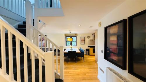 a hallway with a dining room and a dining table at Hustyns Hotel in Wadebridge