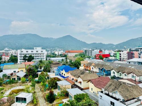 an aerial view of a city with buildings and mountains at Patong best location Apartments, 2 bedrooms in Patong Beach