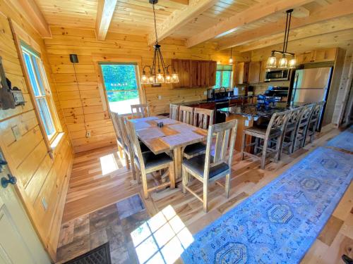 an overhead view of a dining room and kitchen in a log cabin at 84UVR in Bethlehem