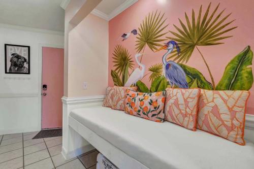 a room with a bird mural on the wall at Private Balcony - Beach - Pool and Pickleball in Tybee Island