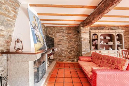a living room with a couch and a fireplace at Casa da Joana in Mirandela