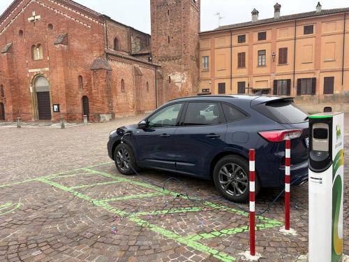 a car parked in a parking lot in front of a building at Museo Grillo Camere d'Arte, dormire nel Museo in Arena Po