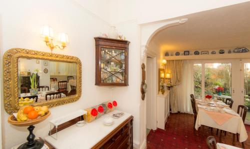a bathroom with a sink and a mirror on the wall at Shoreline Accommodation in Bournemouth